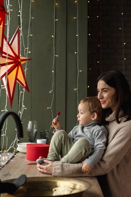 Mother and son watching through the window