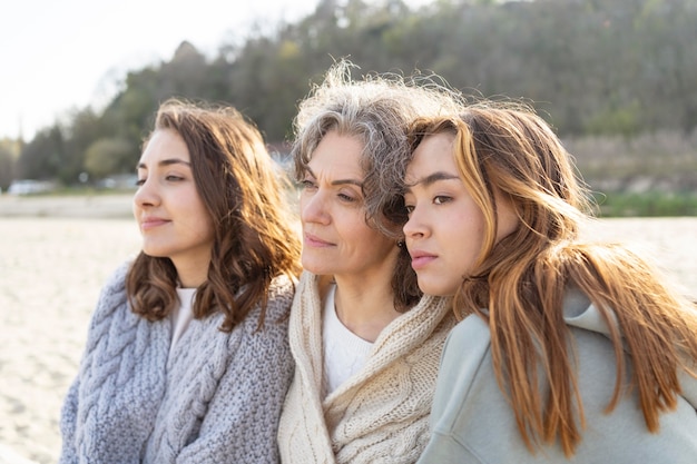 Mother spending time at the beach with her two daughters