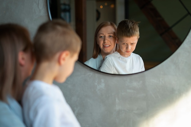 Mother taking care of her autistic son at home