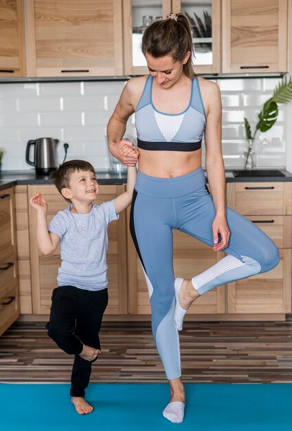 Mother training together with son at home