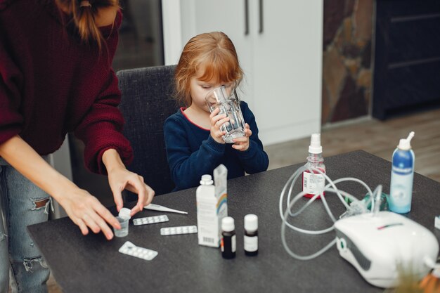 Free photo mother treats her daughter at home