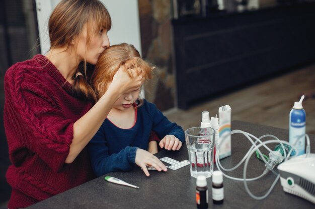 Mother treats her daughter at home