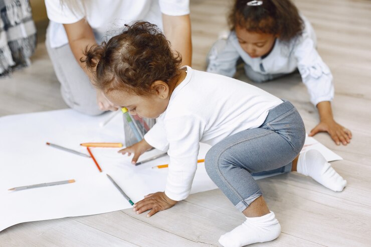 Free Photo mother and two afro-american daughters drawing together. adult woman spending time with her little girls.