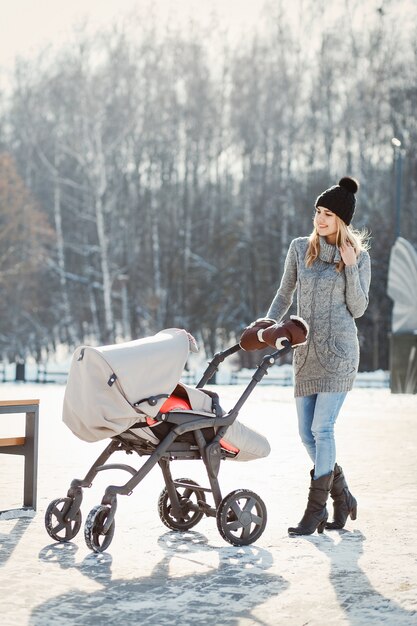 Free photo mother with carriage