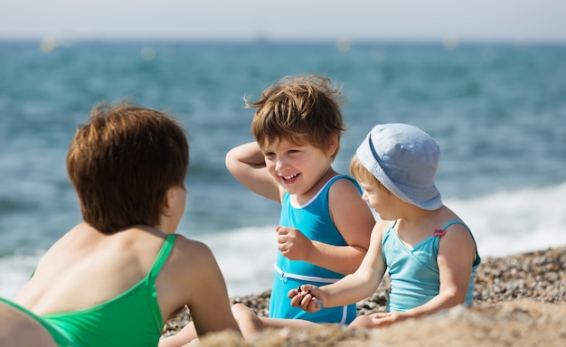 mother with  children at  beach