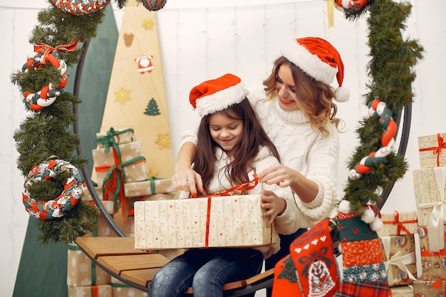 Mother with cute daughter in a christmas decorations