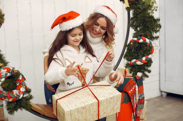 Mother with cute daughter in a christmas decorations