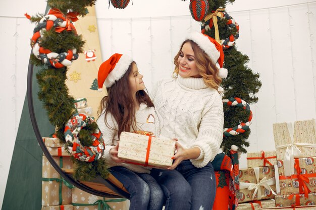 Mother with cute daughter in a christmas decorations