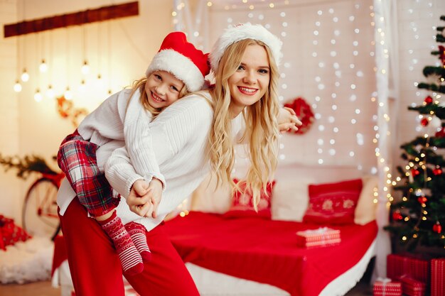 Mother with cute daughter at home