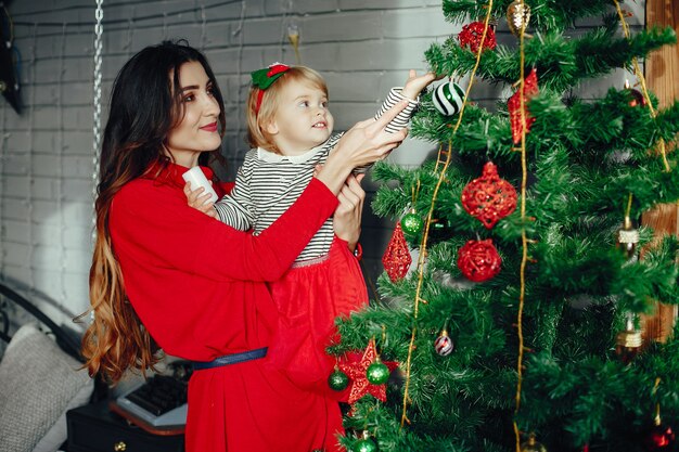 Mother with cute daughter at home