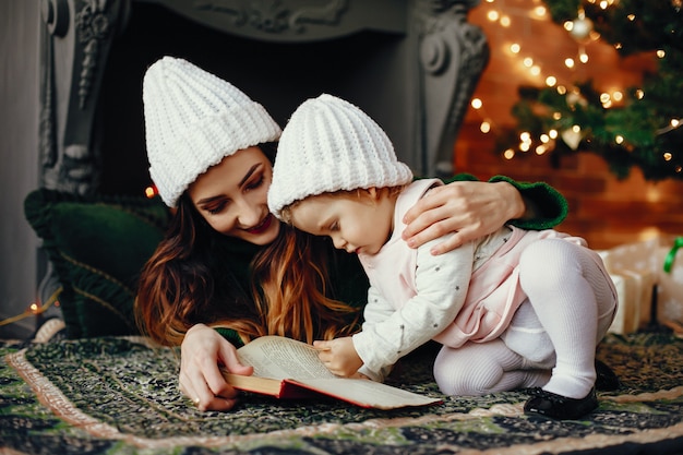 Mother with cute daughter at home