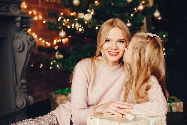 Mother with cute daughter at home