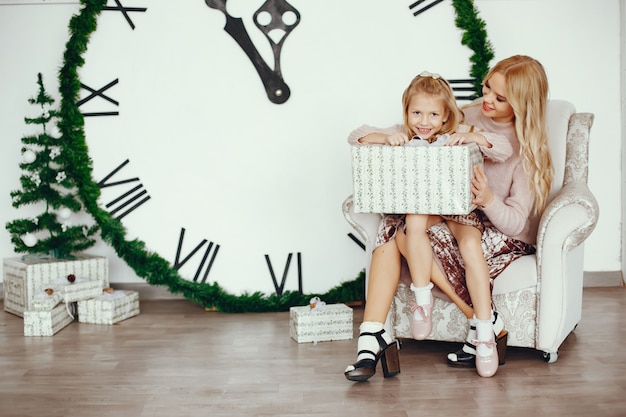 Mother with cute daughter at home