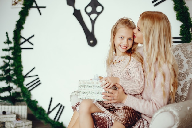 Mother with cute daughter at home