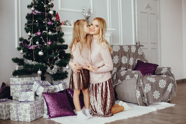 Mother with cute daughter at home