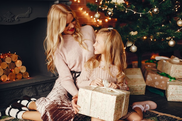 Mother with cute daughter at home