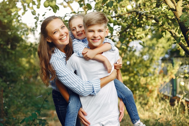 Mother with cute kids in a spring park