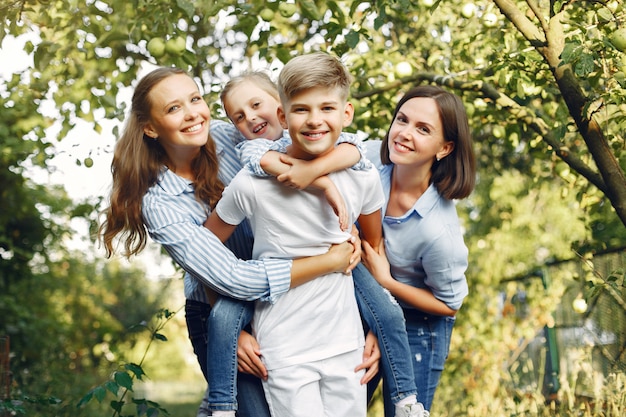 Free photo mother with cute kids in a spring park