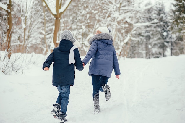 Mother with cute son in a winter oark