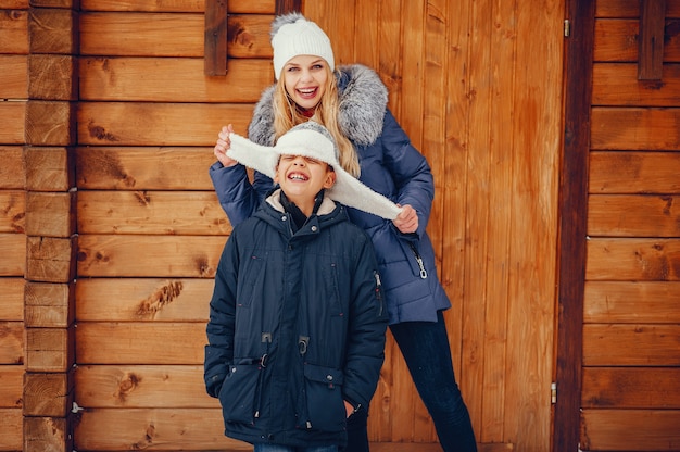 Mother with cute son in a winter oark