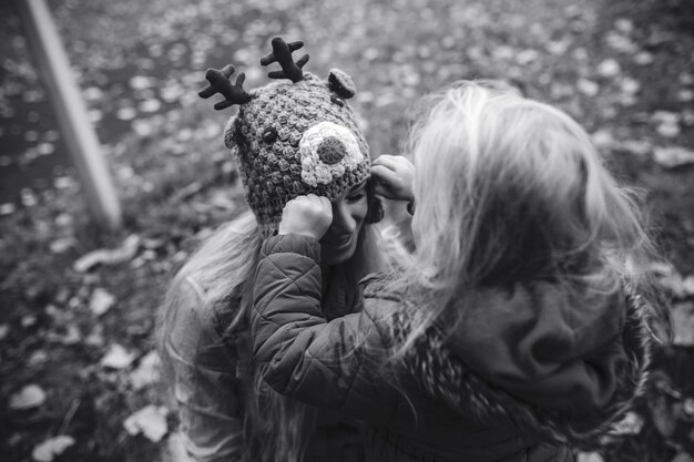 Mother with daughter in autumn park