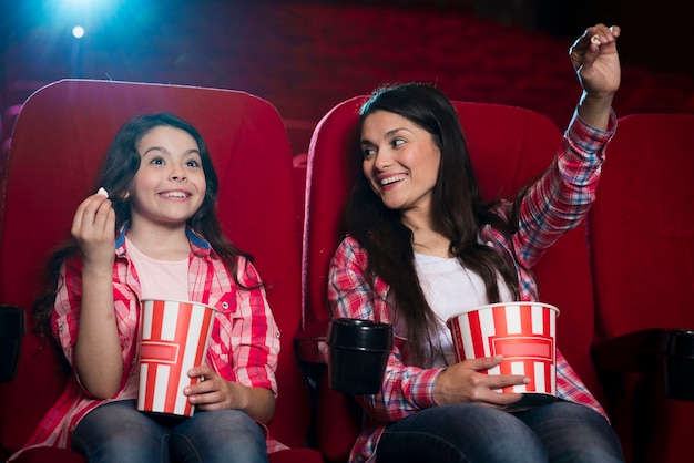 Mother with daughter in cinema