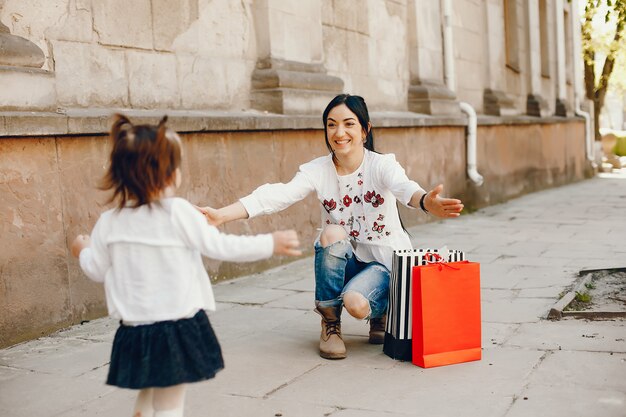 Mother with daughter in a city