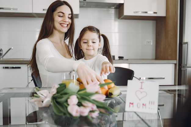 Mother with daughter at home