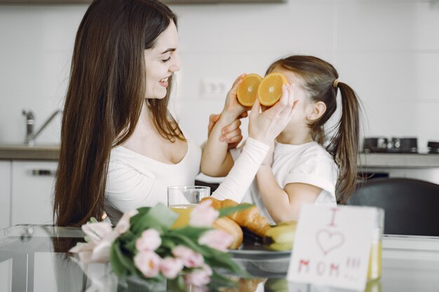 Mother with daughter at home