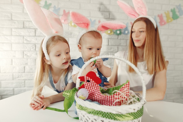 Mother with daughter in a kitchen preparing to easter