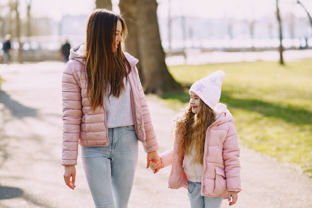 Mother with daughter playing in a park