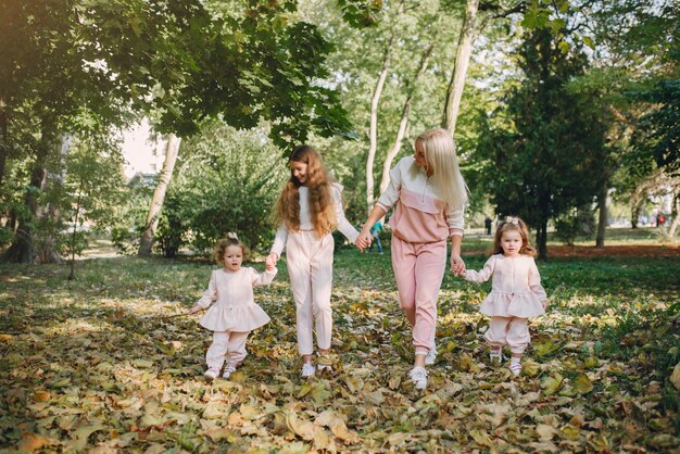 Mother with daughter playing in a summer park