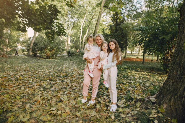 Mother with daughter playing in a summer park