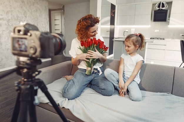 Mother with daughter shoots a blog at home