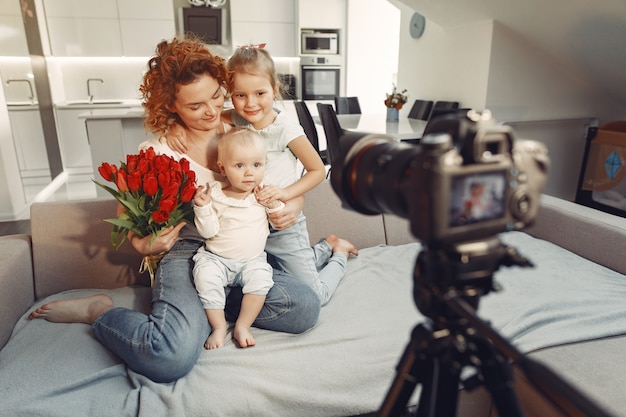 Mother with daughter shoots a blog at home