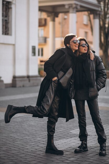 Mother with daughter together at the street