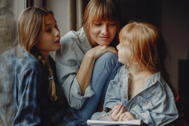 Mother with daughters at home