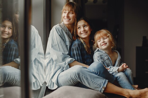 Mother with daughters at home