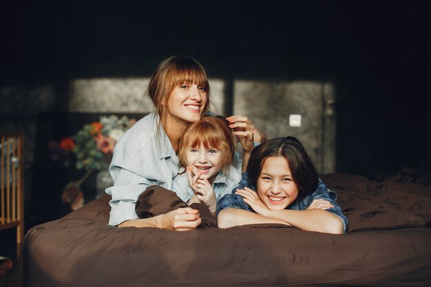 Mother with daughters at home