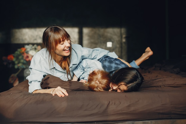 Mother with daughters at home