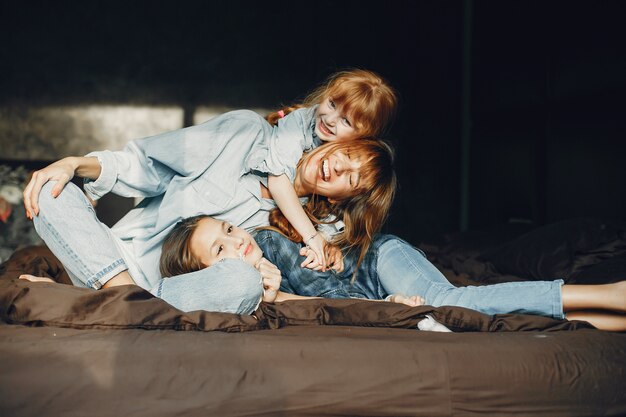 Mother with daughters at home