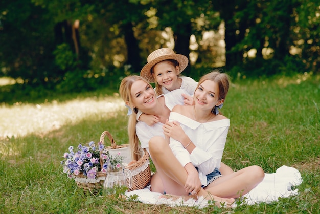 mother with daughters in a park