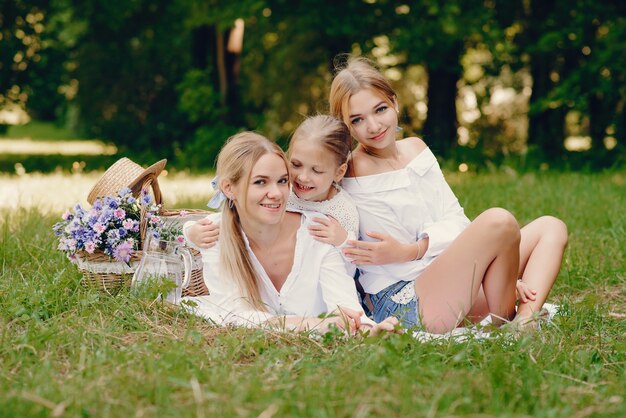 mother with daughters in a park