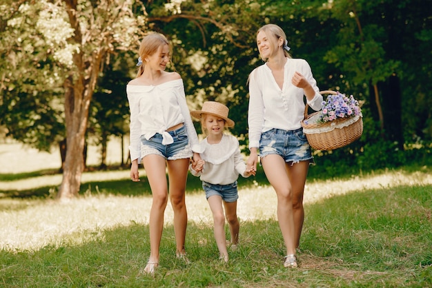 mother with daughters in a park