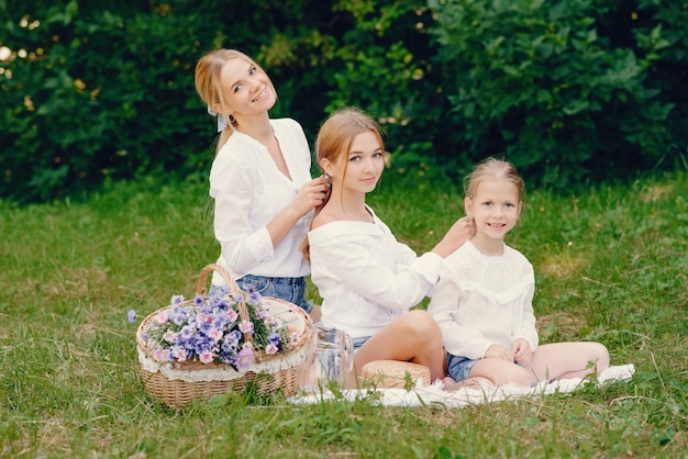 mother with daughters in a park