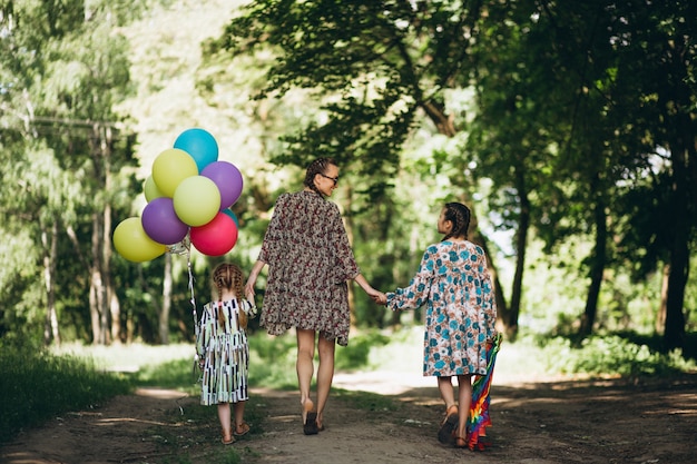 Mother with daughters in park