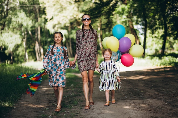 Mother with daughters in park