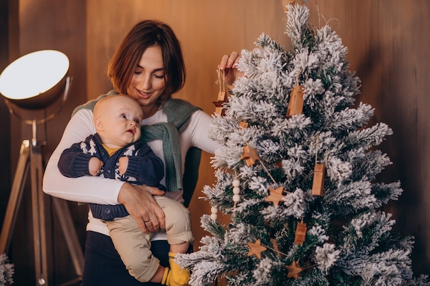 Mother with her baby boy celebrating christmas