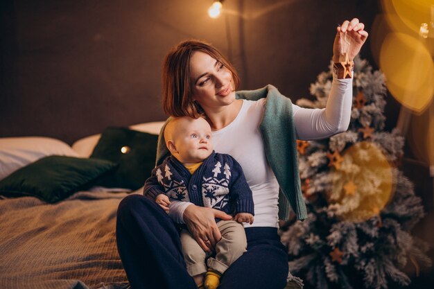 Mother with her baby boy celebrating christmas