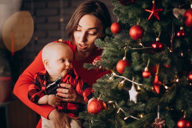 Mother with her baby boy celebrating christmas